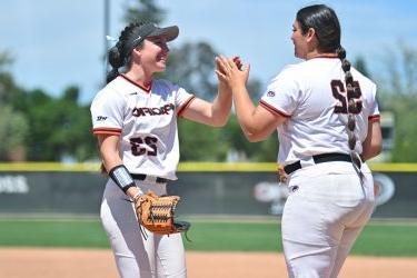 Pacific softball celebrates with high five