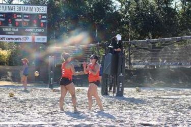 Beach volleyball celebrates point scored