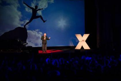 A speaker stands on stage during a previous TEDx event at Pacific.