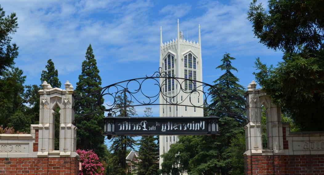 university sign with Burns Tower in background